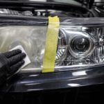 Headlight restoration before and after with a clear polished lens