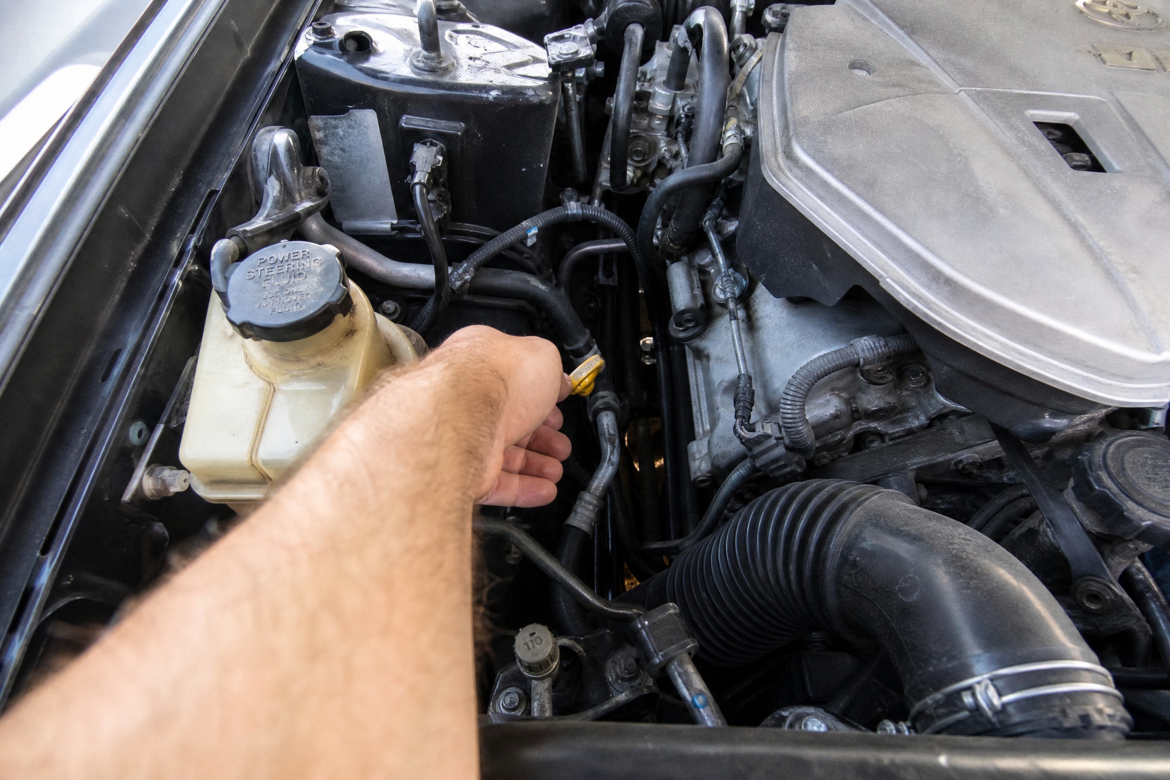 Reading a transmission dipstick with the engine idling in park