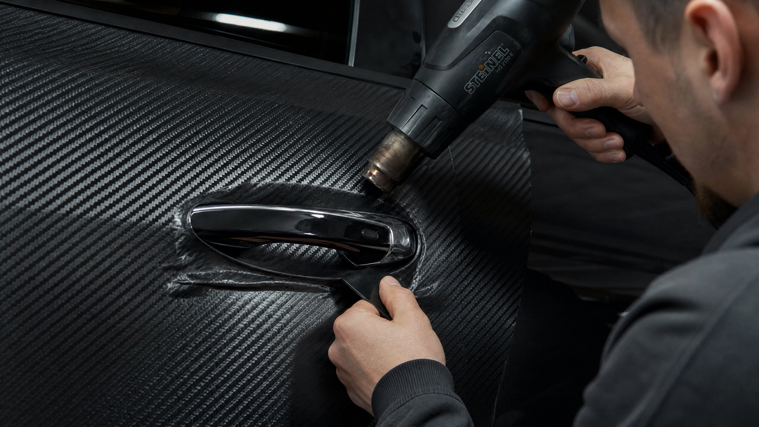 Applying vinyl wrap with heat gun